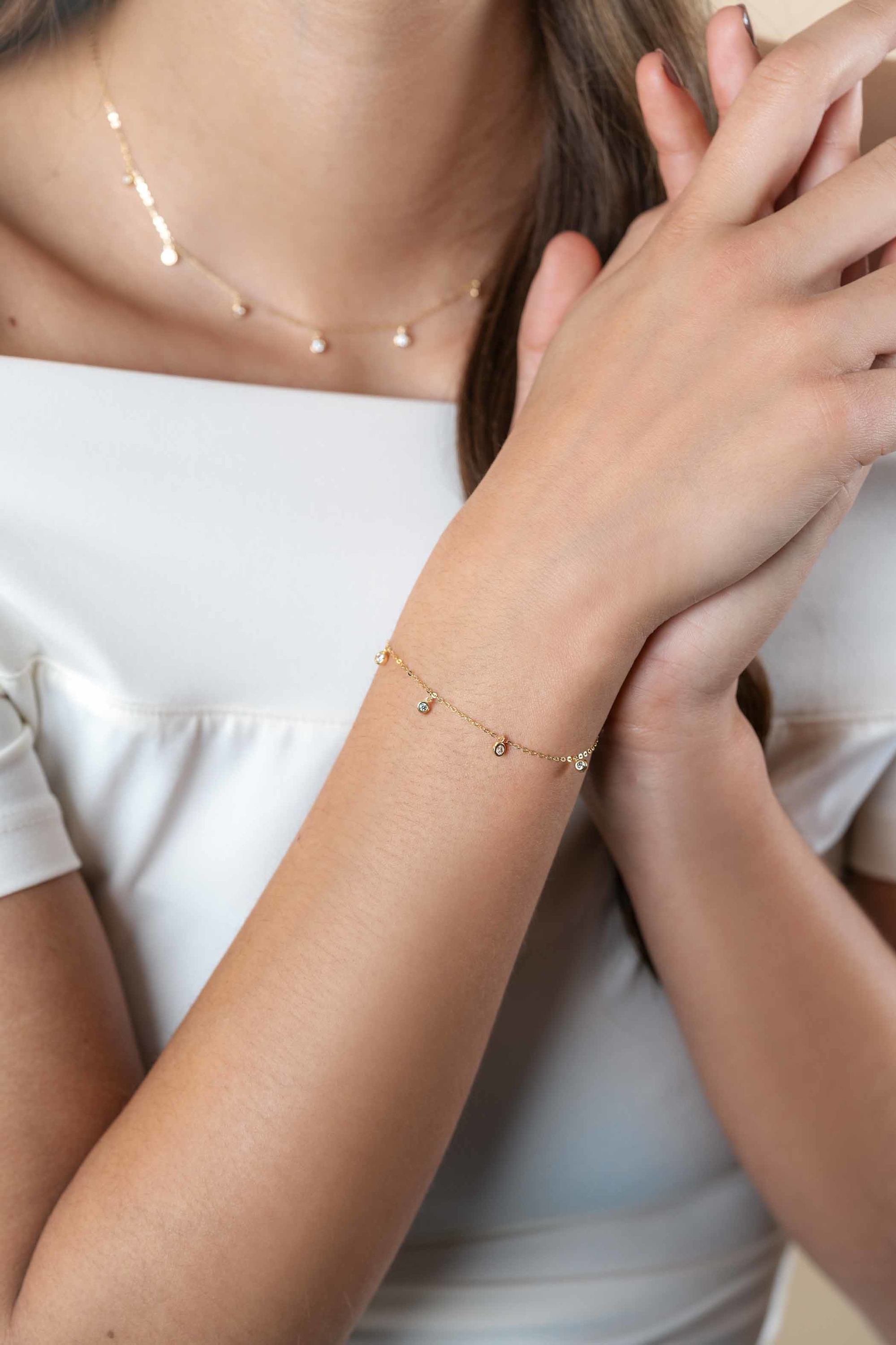 ZINZI 14K Gold Bracelet 7 Round Charms White Zirconias 15,5-18,5cm ZGA451