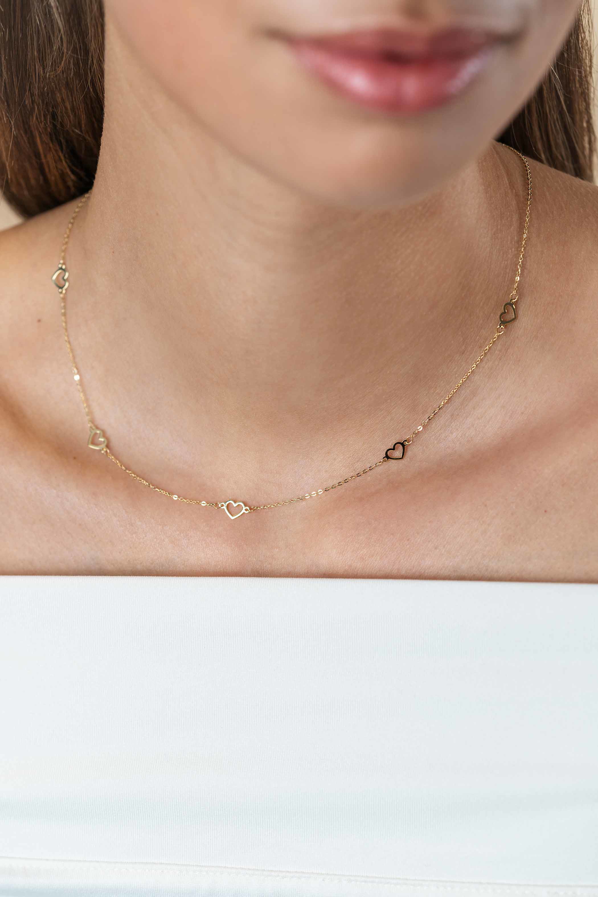ZINZI Gold 14 krt gouden ketting met subtiele jasseron schakels en vijf open hartjes 5mm breed 42-45cm ZGC504
