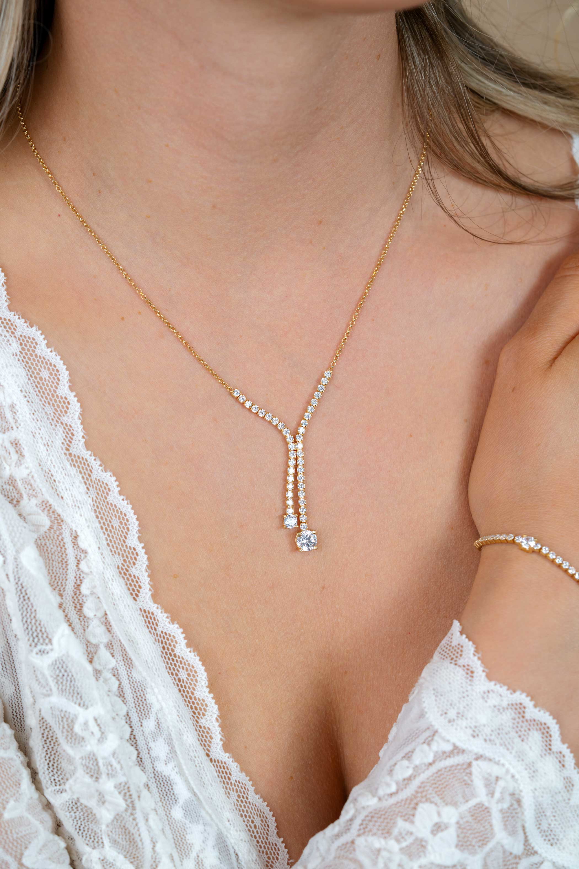 ZINZI gold plated zilveren Y-collier 45cm met luxe tennislook en witte zirkonia's in rijzetting met twee grotere witte zirkonia's ZIC2894Y