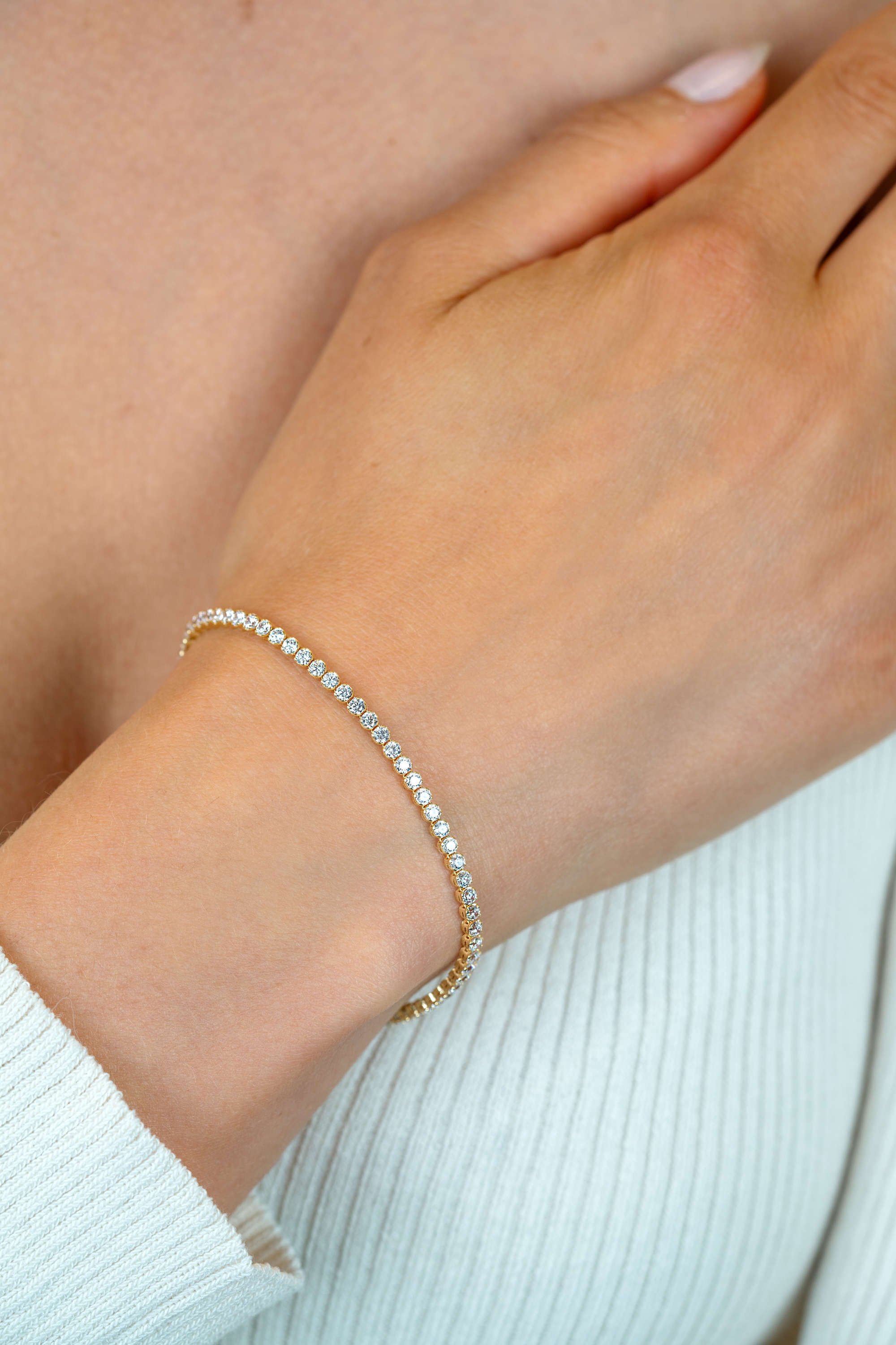 ZINZI gold plated silver tennis bracelet 2.5mm wide set with white zirconia in round settings 17-20cm ZIA2590Y