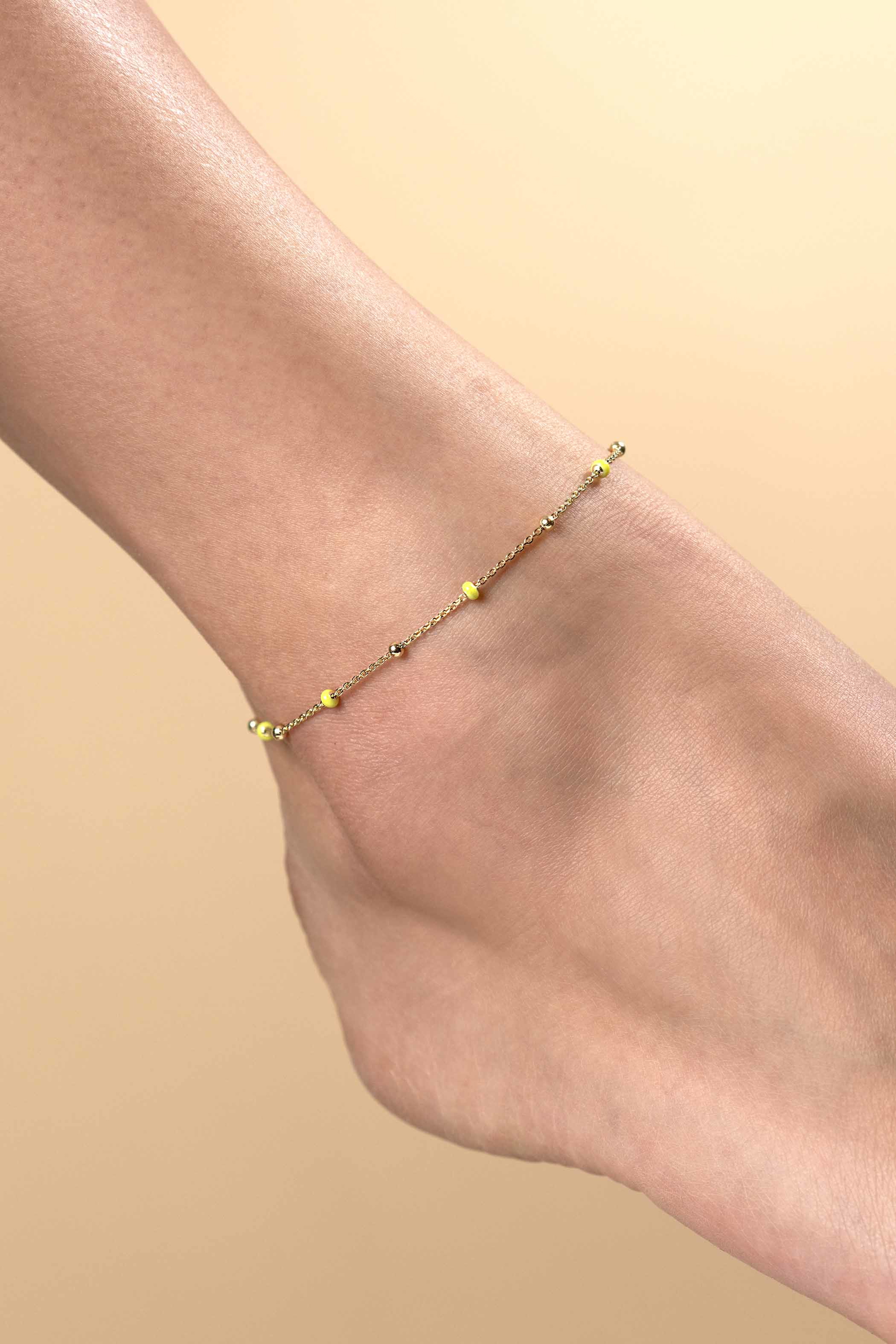 ZINZI gold plated zilveren fantasie enkelband met 7 geelgroene donuts en glanzende bolletjes 23-27cm ZIE2508
