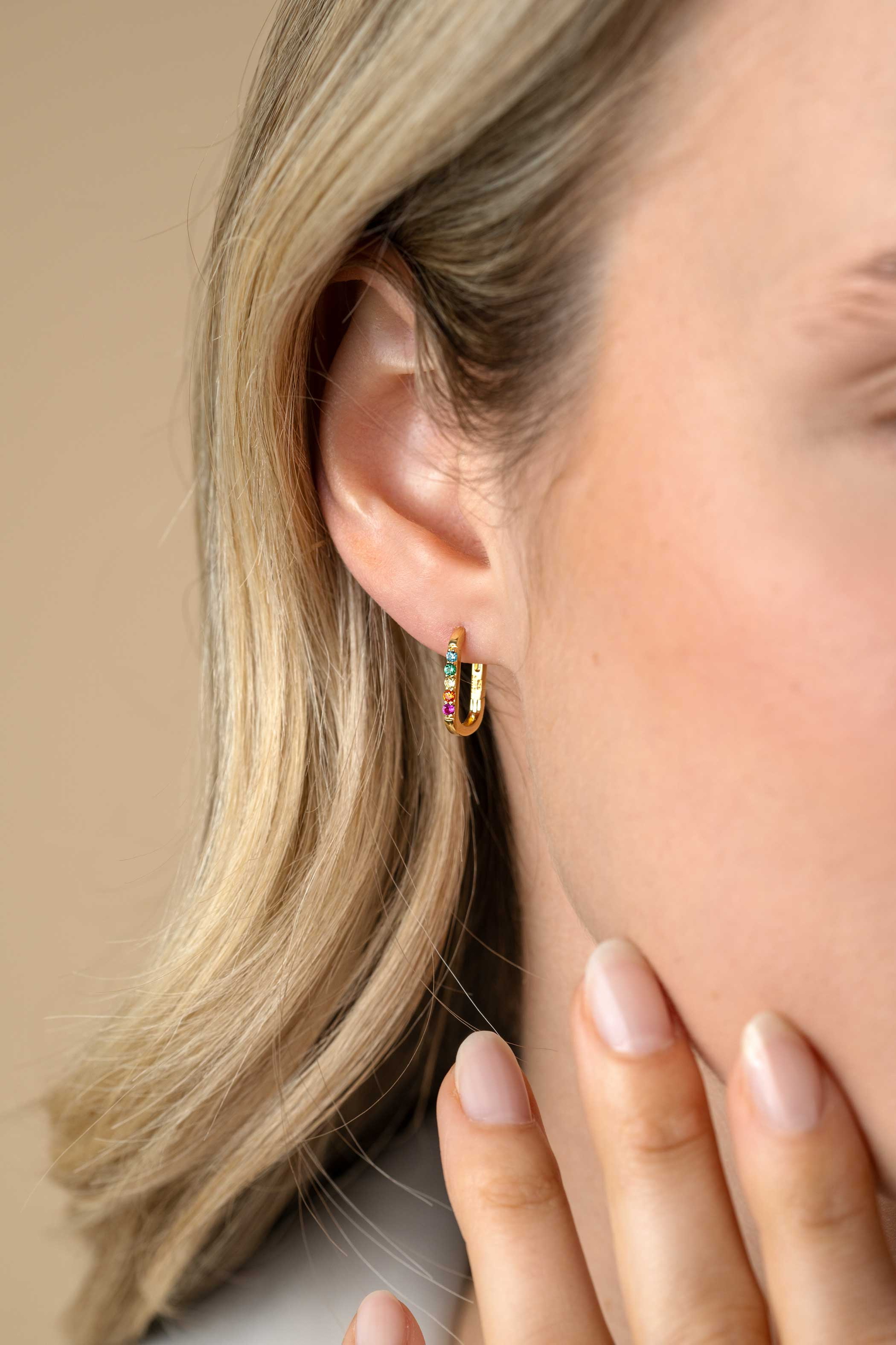 14mm ZINZI gold plated silver luxury hoops in oval shape set with rainbow coloured stones ZIO2598