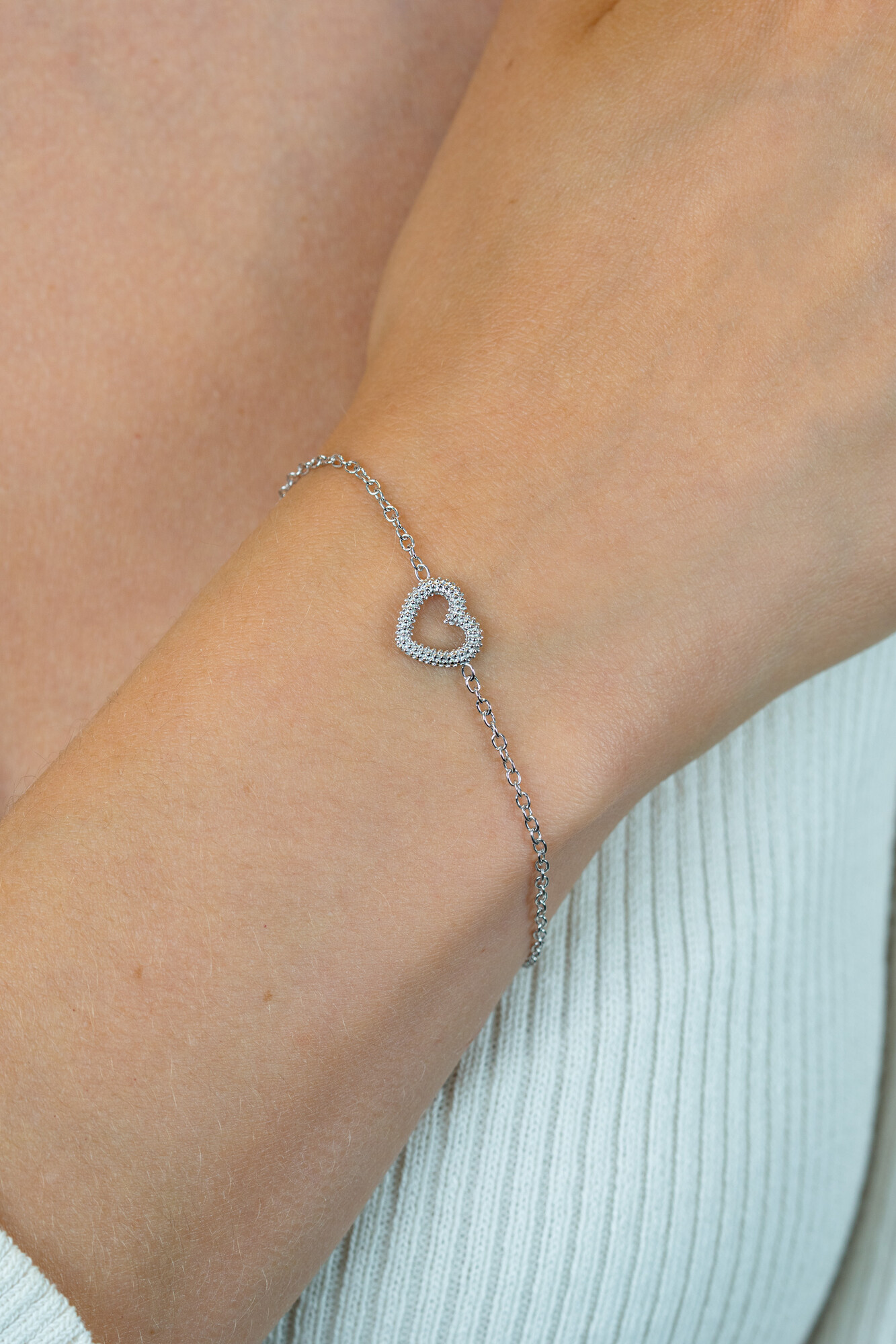 ZINZI zlv. armband met bewerkt open hartje